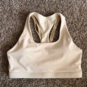cream fabletics sports bra in size large